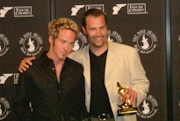 Toby McKeehan (left) with Mark Heimermann, accepting an award at the 32nd Annual Dove Awards