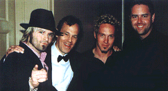 Kevin Max and Toby McKeehan pictured with EMI North America's Deputy President, Roy Lott, and ForeFront President Greg Ham at a Dove Awards after-party